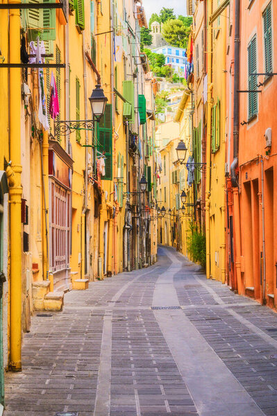 Vibrant narrow street in the French Riviera town of Menton.