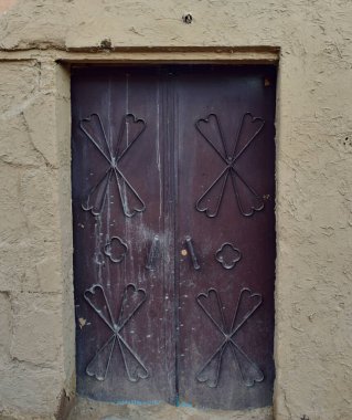 An old decorated Arabic door in Old Town Al Ula in Saudi Arabia clipart