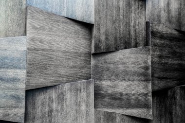 Ahşap duvar bir sürü ahşap fayansla birleşir. Ahşap doku arka planı. Siyah beyaz fotoğraf