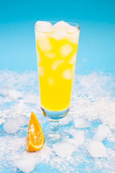 Drink orange with ice in glass