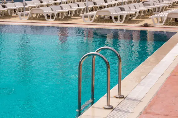 Swimming pool with iron stairs