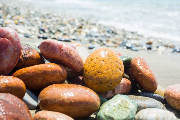 Sea stones on sea background