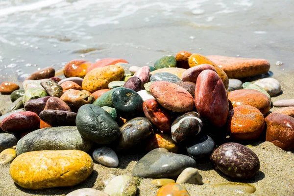 Sea stones on sea background