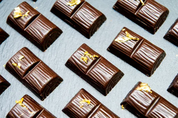 The chocolate candies decorated with edible gold powder