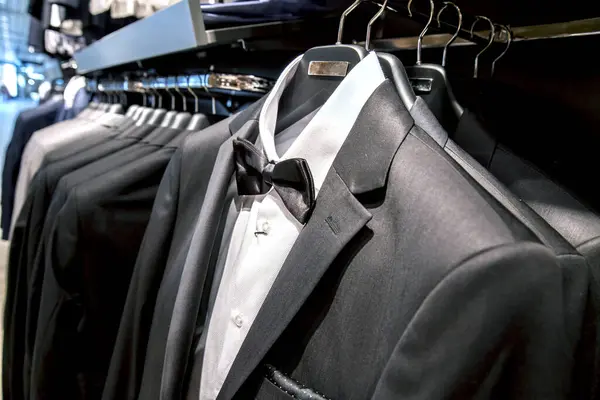 Row of men suits on hangers