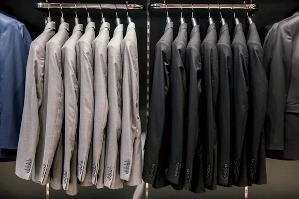 Row of men suits on hangers