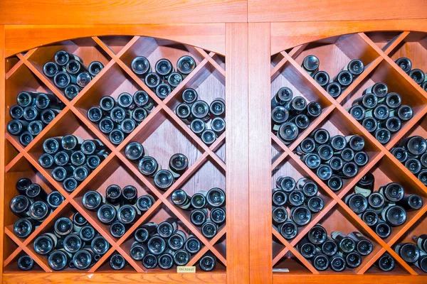 bottles of red wine on the shelves
