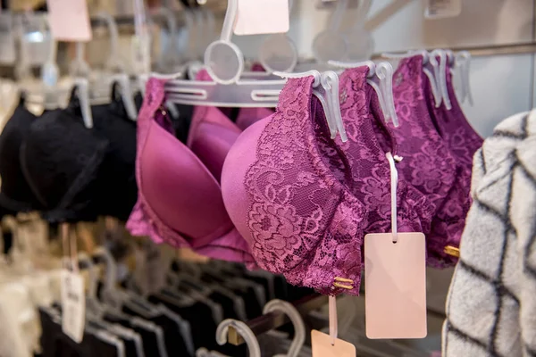 women`s underwear on hangers in clothes store