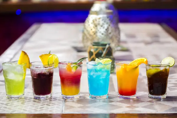 Set of colorful cocktails in bar