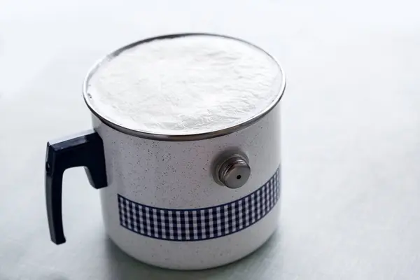 boiled milk in iron pan