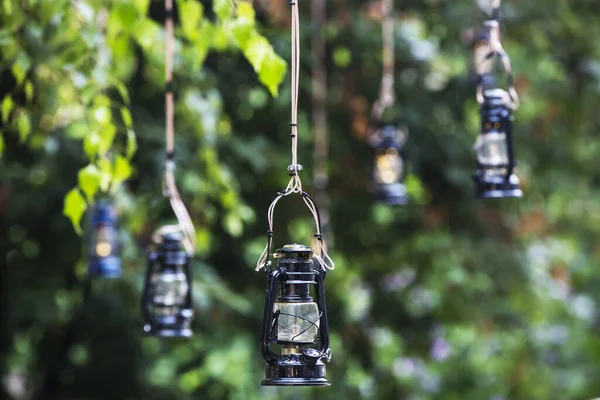 vintage kerosene oil lantern lamps hanging on the wire