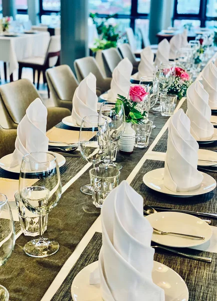 Tables set for a special event or wedding reception. Luxurious elegant tables - preparations for dinner in a restaurant. Party - event concept.