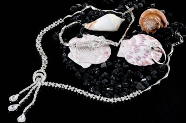 Closeup of jewelery with precious stones.