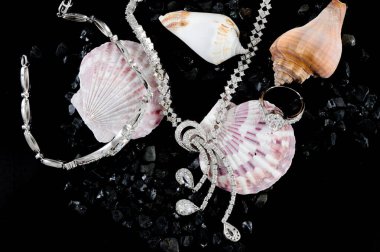 Closeup of jewelery with precious stones.