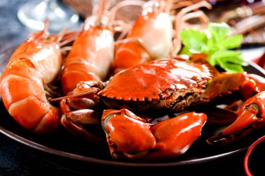 Seafood bake with prawns shrimps and crab mussel dinner.