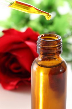 Aromatherapy bottles with essential oil and flowers