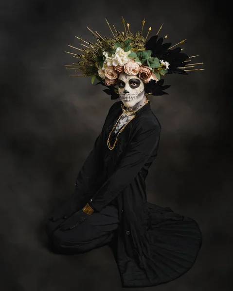 Stock image Studio portrait of Drag Queen catrin. Catrin dressed in black with flower crown. Makeup for halloween or day of the dead.