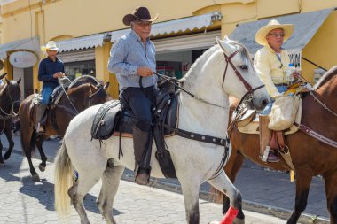 Colima, Colima, Mexico. February 11, 2023. Man riding a horse in the horseback riding for the charro bullfighting festivities in the city of Villa de Alvarez.