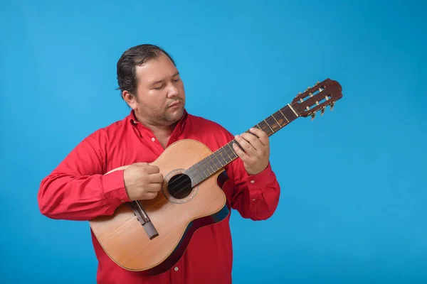 Stock image Studio portrait of a man playing an old Cuban tres.