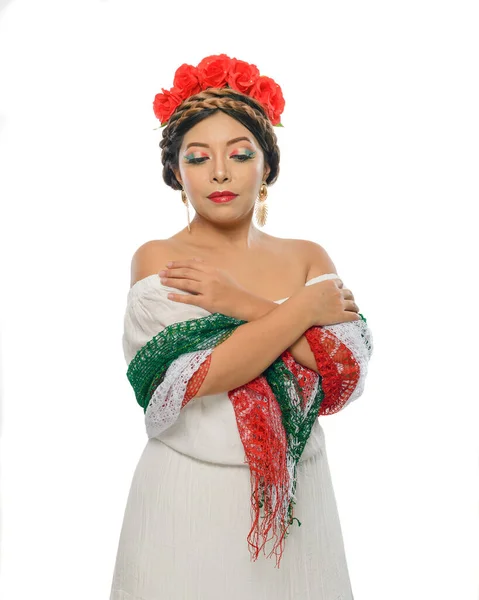 stock image Mexican woman with scarf and tricolor make-up wearing white dress . Woman with scarf and makeup with the colors of the Mexican flag. White background.