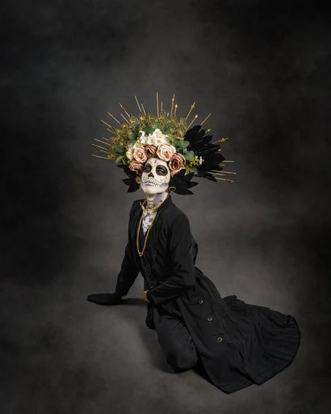 Stock image Studio portrait of Drag Queen catrin. Catrin dressed in black with flower crown. Makeup for halloween or day of the dead.