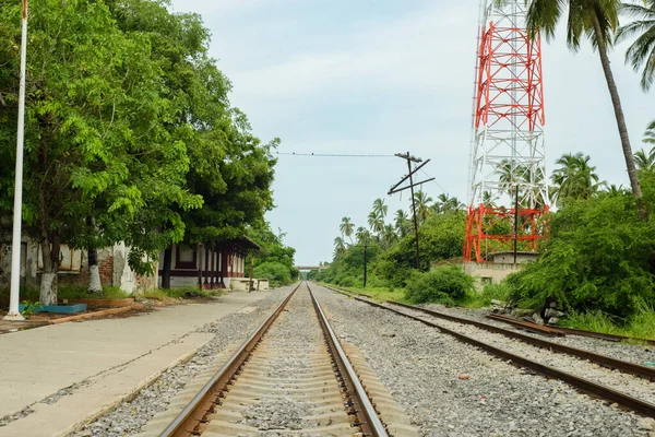 stock image Railroad tracks and small abandoned train terminal.