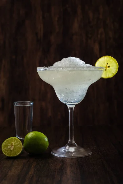 Margarita; classic Mexican cocktail. Cocktail isolated on dark background. Margarita frappe.