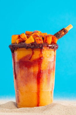 Mangonada, typical mexican mango smoothie with chamoy sauce and lime juice. clipart