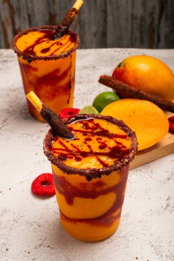 Mangonada, typical mexican mango smoothie with chamoy sauce and lime juice. clipart