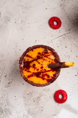 Mangonada, typical mexican mango smoothie with chamoy sauce and lime juice. Top view. clipart