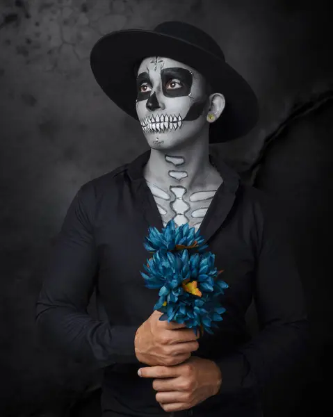 stock image Man with catrin makeup wearing hat. Studio portrait. Day of the Dead Celebration.