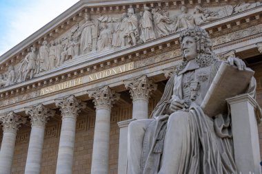 Paris, France - February21, 2023: Main facade of the National Assembly building (Assemblee Nationale), aka Palais Bourbon or chamber of deputies, elected representatives in the French parliament