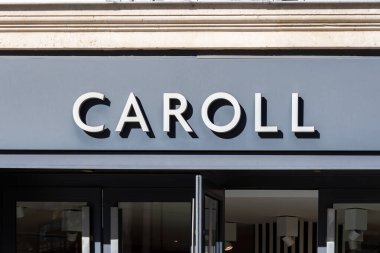 Paris, France - February 27, 2023: Commercial sign of a Caroll boutique, a French women's ready-to-wear fashion and accessories company