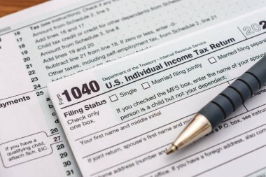 US individual Income tax return document. People have to complete the form 1040 every year to declare their income from the previous year to the Internal Revenue Service of the Department of Treasury 