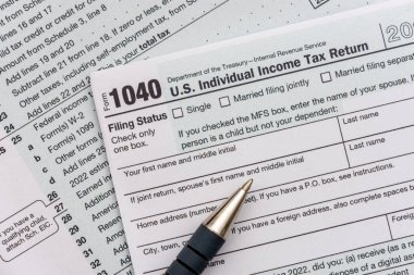 US individual Income tax return document. People have to complete the form 1040 every year to declare their income from the previous year to the Internal Revenue Service of the Department of Treasury 