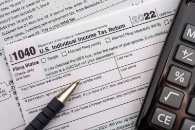 US individual Income tax return document. People have to complete the form 1040 every year to declare their income from the previous year to the Internal Revenue Service of the Department of Treasury  clipart