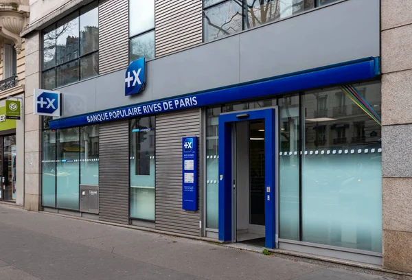 stock image Paris, France - March 23, 2023: Exterior view of a branch of Banque Populaire Rives de Paris, a regional mutual bank attached to the BPCE group