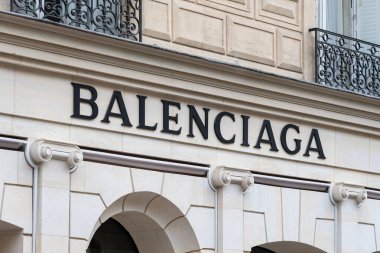 Paris, France - March 29, 2023: Sign of the historic Balenciaga store, 10 avenue George V in Paris, France. Balenciaga is a French company specializing in fashion and luxury clipart