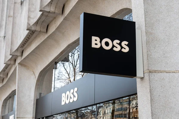 stock image Paris, France - March 29, 2023: Commercial sign of the Hugo Boss store (Boss Store Paris) located on the avenue des Champs-Elysees in Paris, France