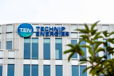 Nanterre, France - October 9, 2023: Sign and logo on the facade of the headquarters of Technip Energies, a company of French origin present in engineering for the energy industry, chemistry and mining clipart