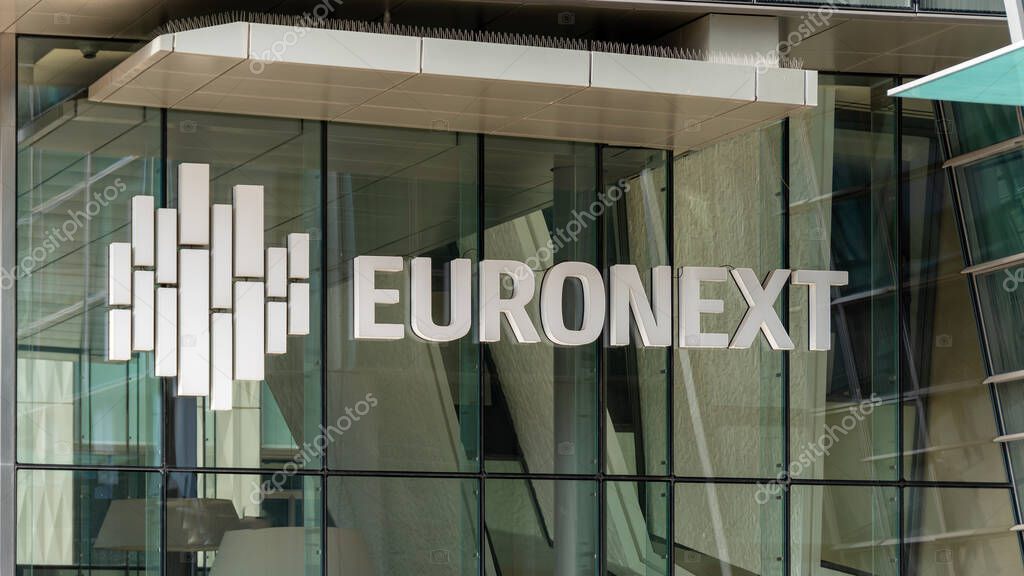 Courbevoie, France - October 9, 2023: Sign and logo at the entrance to the Euronext building in the Paris La Defense business district. Euronext is the main stock exchange in the euro zone