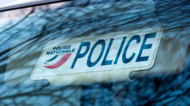 Paris, France - January 5, 2024: Close-up of the sun visor plate of an unmarked police vehicle with the word 