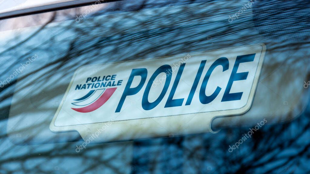 Paris, France - January 5, 2024: Close-up of the sun visor plate of an unmarked police vehicle with the word 