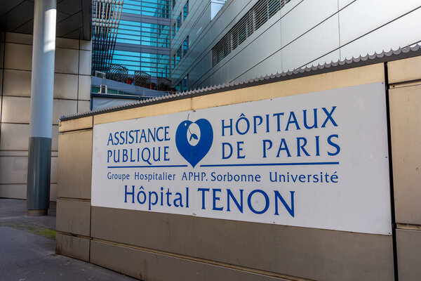 Paris, France - March 22, 2024: Sign of the Tenon hospital (Meyniel building). The Tenon Hospital (Hpital Tenon) is part of the Groupe Hospitalier Universitaire AP-HP Sorbonne Universite of Paris