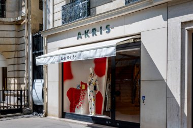 Paris, France - April 18, 2024: Exterior view of an Akris store in Paris. Akris is a Swiss luxury fashion house specializing in haute couture and women's ready-to-wear clothing clipart