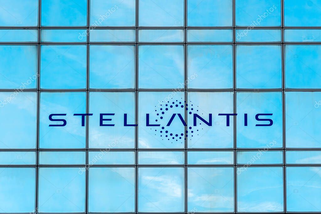 Poissy, France - April 21, 2024: Sign and logo on the French headquarters of Stellantis. Stellantis is a multinational automobile group resulting from the merger of the PSA and Fiat Chrysler groups