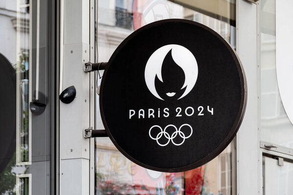 Paris, France - April 28, 2024: Sign of the official store of the Paris 2024 Summer Olympic and Paralympic Games with the official logo and the Olympic rings