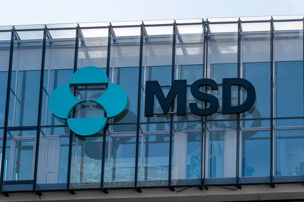 stock image Puteaux, France - May 9, 2024: Sign and logo on the headquarters of Merck Sharp and Dohme (MSD) France, French subsidiary of the American multinational pharmaceutical group Merck and Co. Inc.
