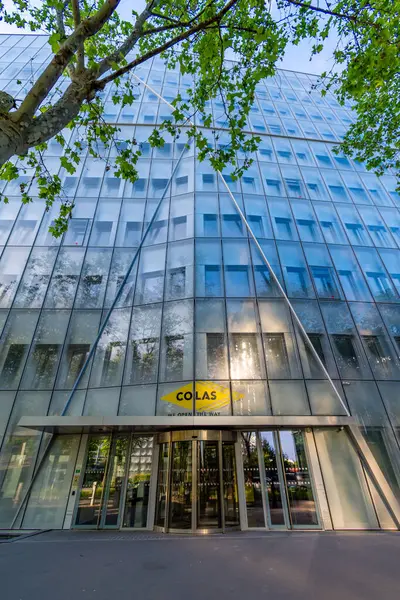stock image Paris, France - May 18, 2024: Entrance to the Colas headquarters building. Colas is a French public works company, subsidiary of the Bouygues group, specializing in transport infrastructure