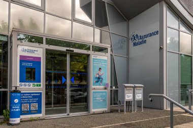 Clermont-Ferrand, France - May 23, 2024: Main entrance to a local office of the French 'Assurance Maladie' (i.e. Medical insurance), the health branch of the social security in France clipart